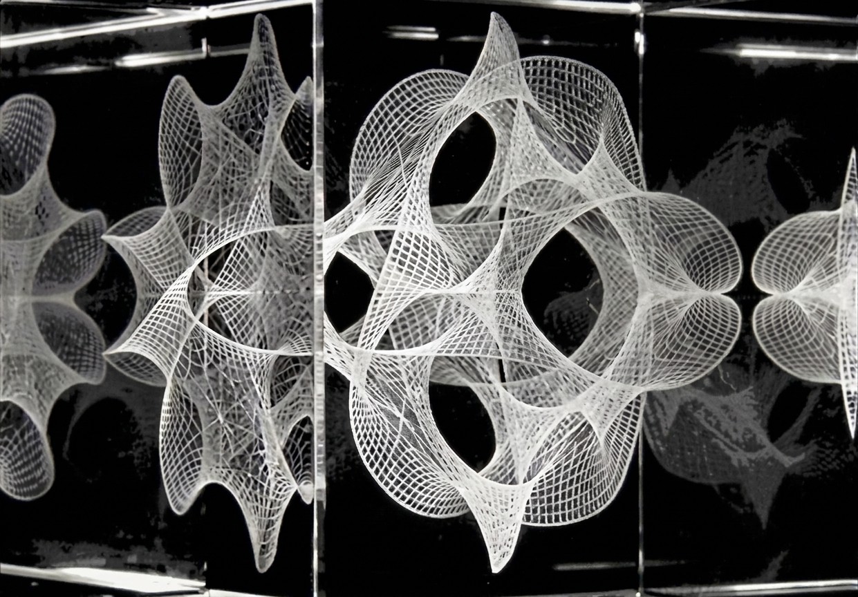 A Calabi–Yau manifold etched in a glass cube.