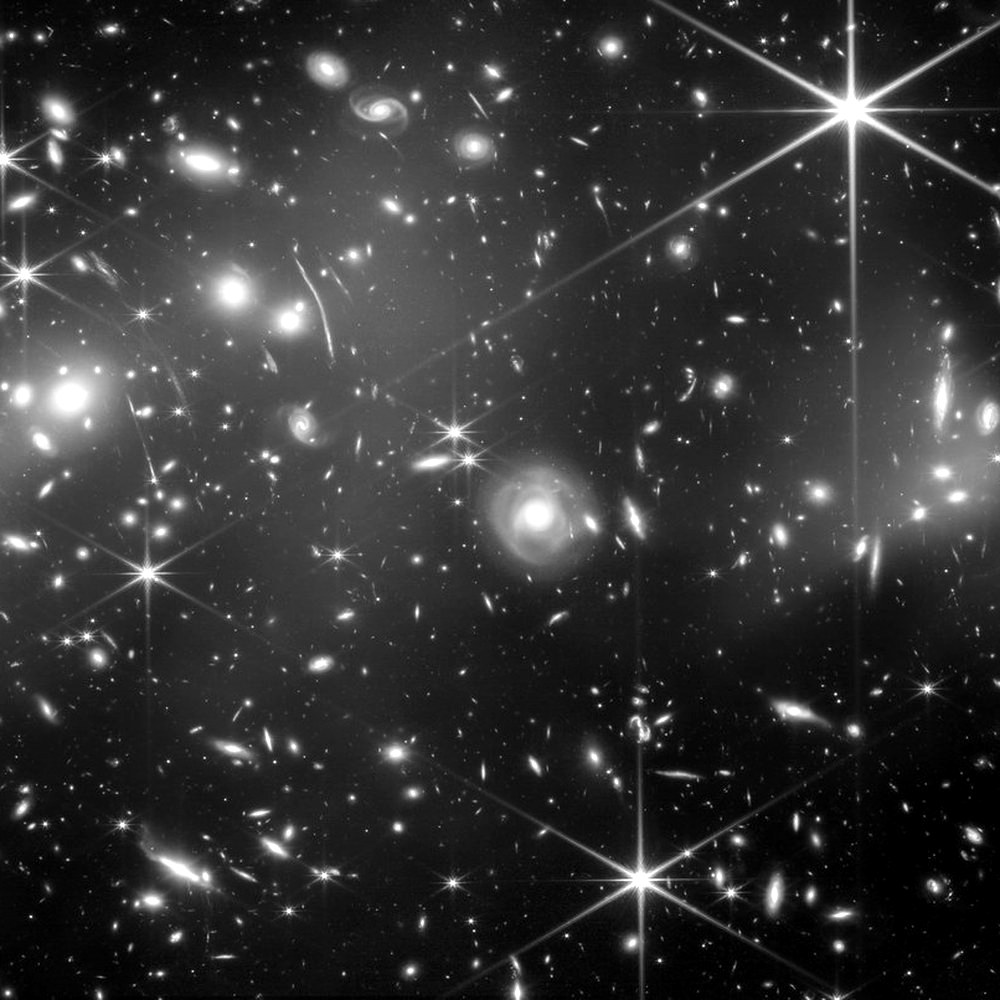 The Bullet Cluster; the blue glow maps dark matter.